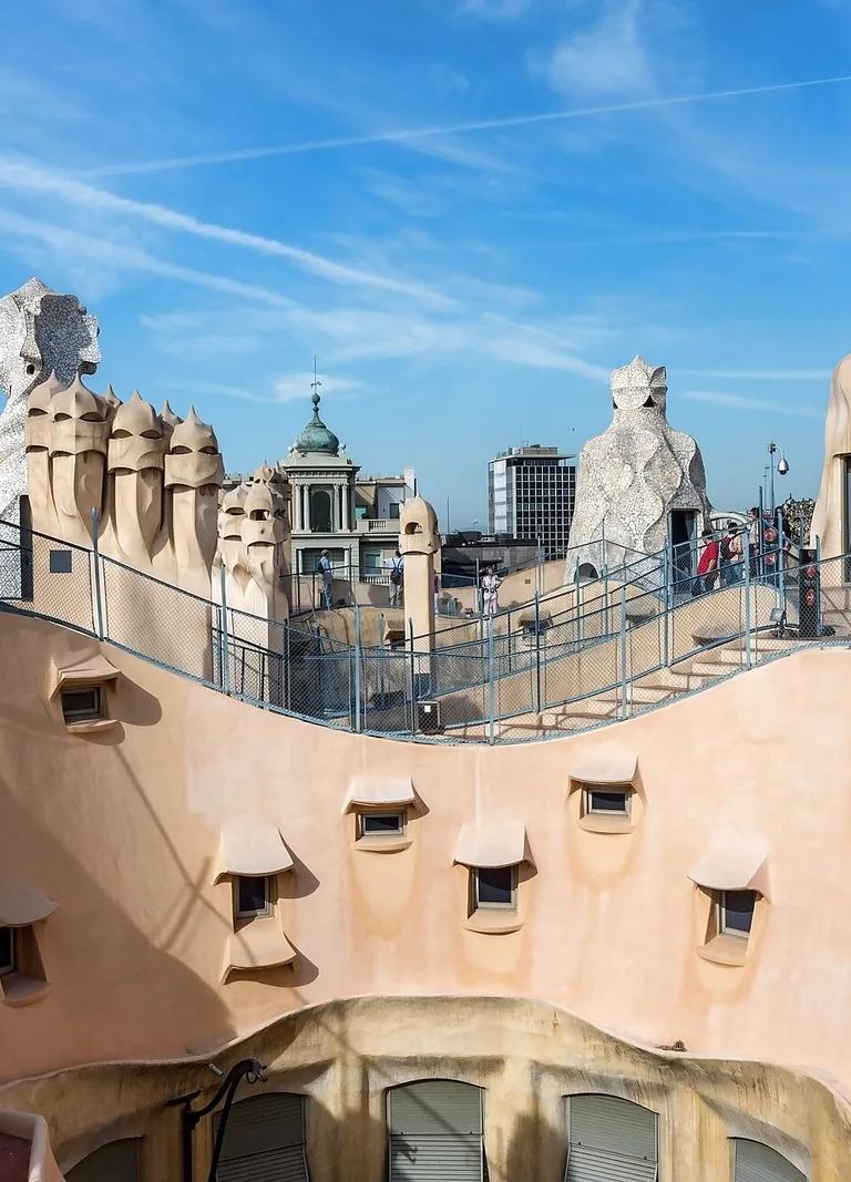 Sculptural chimneys and ventilation towers on the rooftop of Casa Milà