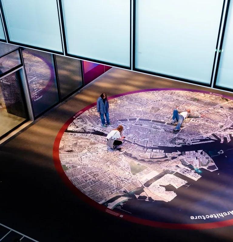 Visitors on the giant aerial City Map of Copenhagen at DAC