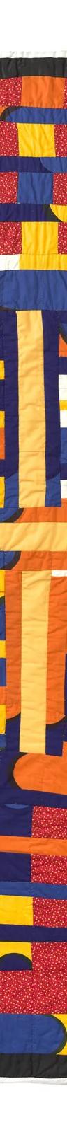 A vibrant, hand-quilted cotton textile features a combination of blue, orange, yellow, and red patchwork.