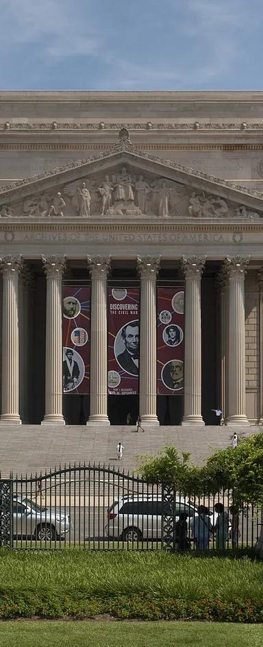 The neoclassical National Archives Building with its Corinthian colonnade, seen from Constitution Avenue, Washington, DC