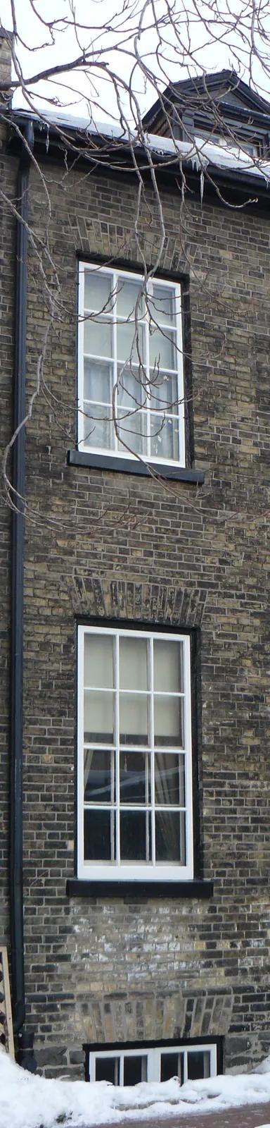 Brick facade of Mackenzie House on Bond Street, Toronto, in winter