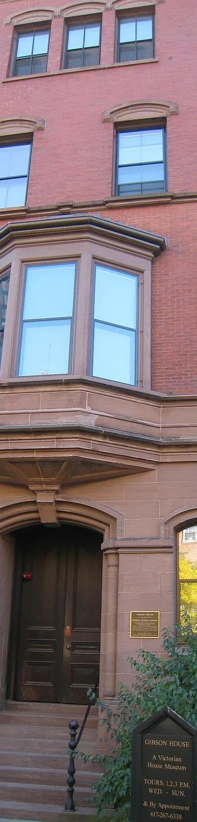 Brownstone and red brick front facade of the Gibson House Museum at 137 Beacon Street in Boston's Back Bay