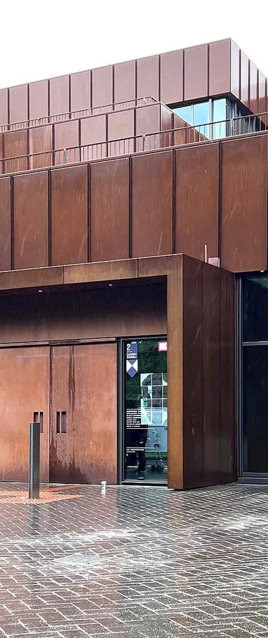 Exterior of the Archäologische Staatssammlung München's Corten-steel building after its 2024 reopening