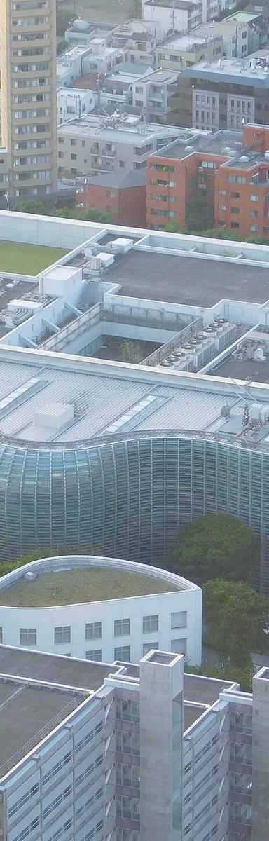 The wave-shaped glass facade of The National Art Center, Tokyo in Roppongi