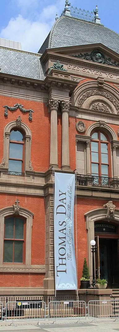 The red brick and sandstone Second Empire facade of the Renwick Gallery in Washington, DC, with mansard roofs and "Dedicated to Art" carved above the entrance