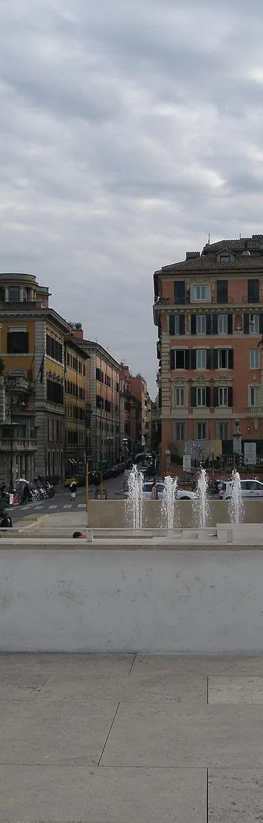 The white glass-and-travertine Ara Pacis museum building designed by Richard Meier, with fountain, beside the Tiber in Rome