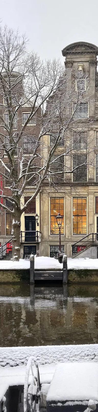 The canal-side facades of Huis Marseille's two 17th-century houses on the Keizersgracht, Amsterdam