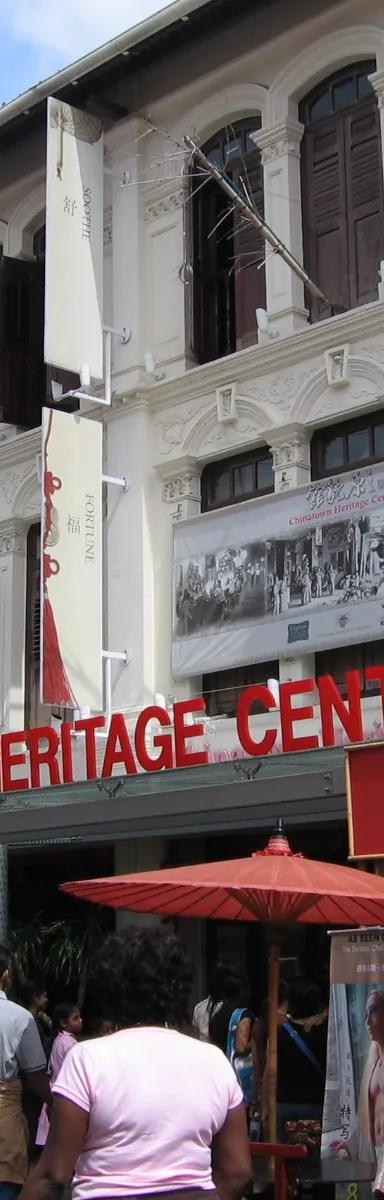 Restored ochre and cream shophouses on Pagoda Street housing the Chinatown Heritage Centre