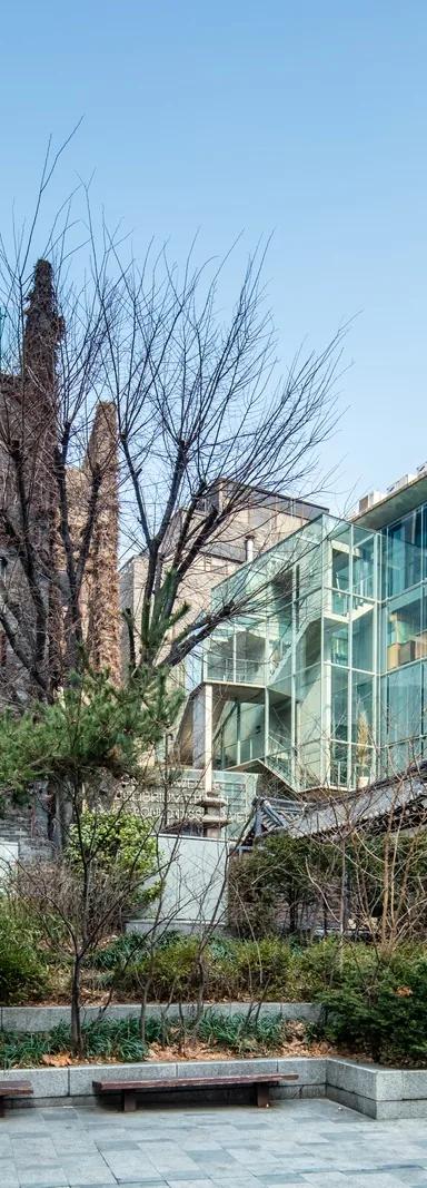 The ivy-covered brick exterior of the former Space Group Building, now Arario Museum in Space, in Seoul