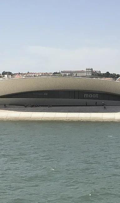 The curving MAAT Gallery building by Amanda Levete, seen from the Tagus river in Belém