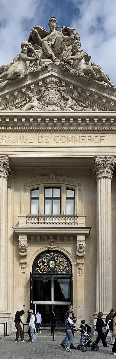 Exterior of the Bourse de Commerce, a circular 18th-century building with a copper-and-glass dome in central Paris