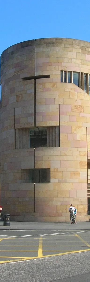 Sandstone exterior of the Museum of Scotland building with its round corner tower on Chambers Street, Edinburgh