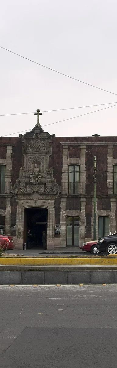 Tezontle and stone façade of the former Hospedería de Santo Tomás de Villanueva on Avenida Hidalgo, home of Museo Kaluz, Mexico City