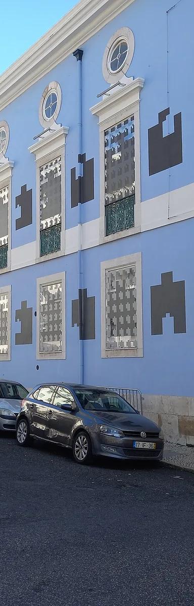Blue-painted facade of the Museu Nacional de Arte Contemporânea do Chiado on Rua Capelo, Lisbon