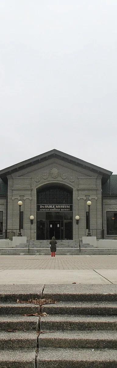 The grey-stone classical-revival exterior of the DuSable Black History Museum in Washington Park, Chicago