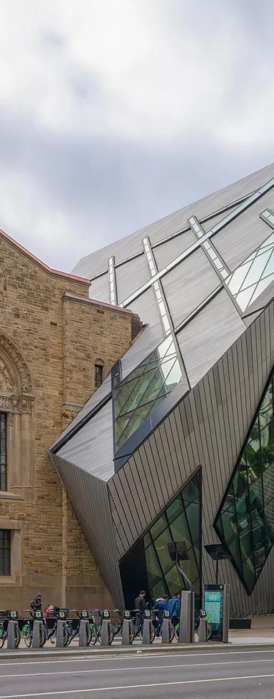 The Royal Ontario Museum's Michael Lee-Chin Crystal and heritage facade on Bloor Street, Toronto, in autumn